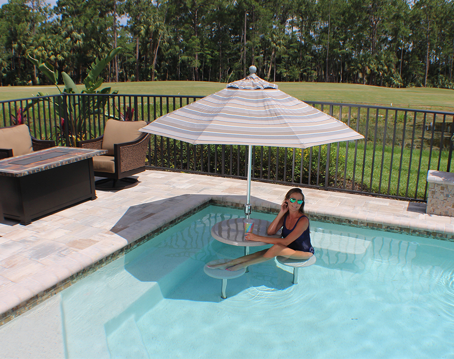 swimming pool table set with umbrella